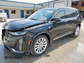 2020 Cadillac XT6 FWD Premium Luxury z VIN 1GYKPCRSXLZ104502, wystawiony jako Copart lot #58211275 z przebiegiem 97 053 mil mil oraz Szkody całkowita. Historia ofert i sprzedaży dostępna na DreamBid. Obrazek 1.