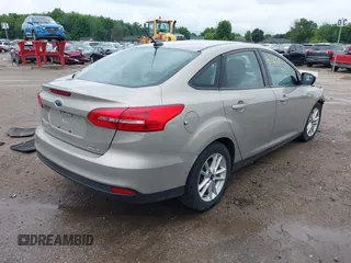 2016 Ford Focus SE z VIN 1FADP3F28GL300925, wystawiony jako IAAI lot #42563251 z przebiegiem 93 247 mil mil oraz . Historia ofert i sprzedaży dostępna na DreamBid. Obrazek 4.