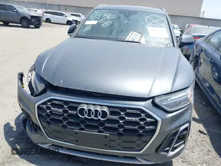 2022 Audi Q5 S line Premium z VIN WA1GAAFY3N2088773, wystawiony jako IAAI lot #41969990 z przebiegiem 22 922 mil mil oraz . Historia ofert i sprzedaży dostępna na DreamBid. Obrazek 13.