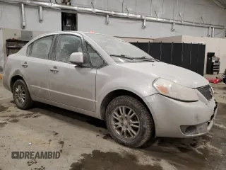 2012 Suzuki SX4 LE with VIN JS2YC5A38C6302014, listed as a Copart auction lot 47006645 with 176,113 mi miles and Salvage Title. Bid and sale history available at DreamBid. Image 4.