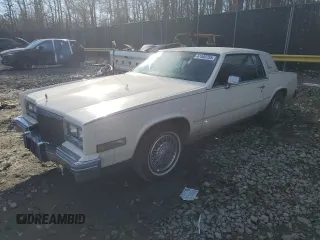 1985 Cadillac Eldorado z VIN 1G6EL5787FE663828, wystawiony jako Copart lot #47460755 z przebiegiem 91 853 mil mil oraz Tytuł czysty. Historia ofert i sprzedaży dostępna na DreamBid. Obrazek 1.