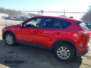 2014 Mazda CX-5 Touring with VIN JM3KE2CY2E0374440, listed as a IAAI auction lot 41634144 with 106,145 mi miles and . Bid and sale history available at DreamBid. Image 15.