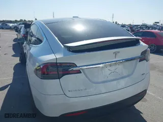 2018 Tesla Model X 75D with VIN 5YJXCAE23JF136499, listed as a IAAI auction lot 41934857 with 83,752 mi miles. Bid and sale history available at carsss.com. Image 3.