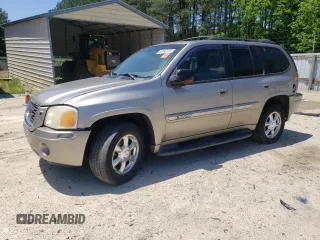 2003 GMC Envoy SLE with VIN 1GKDT13S232340050, listed as a Copart auction lot 57092225 with 231,046 mi miles and Salvage title. Bid and sale history available at DreamBid. Image 1.
