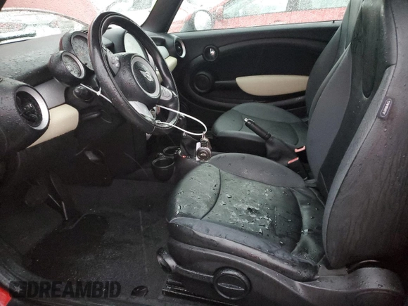 2009 MINI Convertible with VIN WMWMR33539TU96291, listed as a Copart auction lot 83849744 with 65,056 mi miles and Salvage title. Bid and sale history available at DreamBid. Image 7.