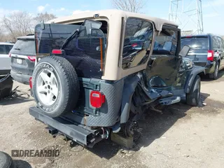 2002 Jeep Wrangler Sport with VIN 1J4FA49S62P743771, listed as a IAAI auction lot 41791205 with 186,622 mi miles. Bid and sale history available at carsss.com. Image 4.