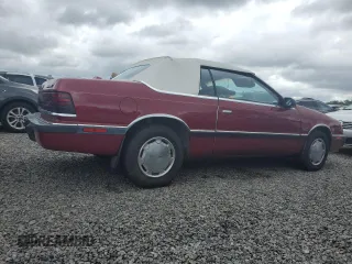 1989 Chrysler LeBaron z VIN 1C3XJ45J8KG223051, wystawiony jako Copart lot #75115464 z przebiegiem 27 923 mil mil oraz Szkody całkowita. Historia ofert i sprzedaży dostępna na DreamBid. Obrazek 3.
