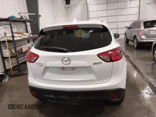 2015 Mazda CX-5 Grand Touring with VIN JM3KE4DY4F0495627, listed as a IAAI auction lot 41887773 with 130,421 mi miles. Bid and sale history available at carsss.com. Image 17.