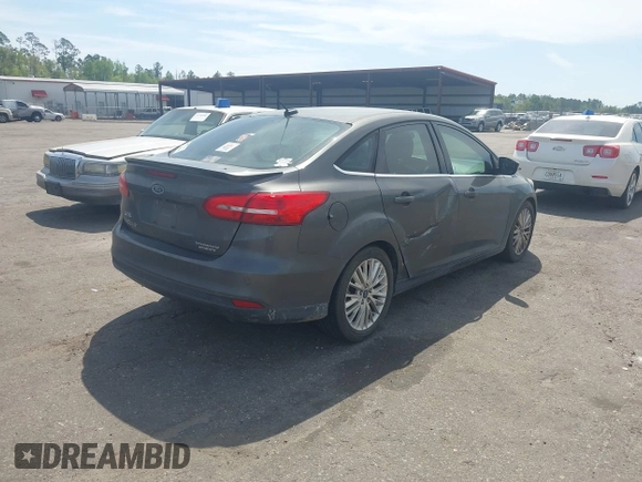 2015 Ford Focus Titanium with VIN 1FADP3J24FL277732, listed as a IAAI auction lot 41903397 with 238,138 mi miles and . Bid and sale history available at carsss.com. Image 4.