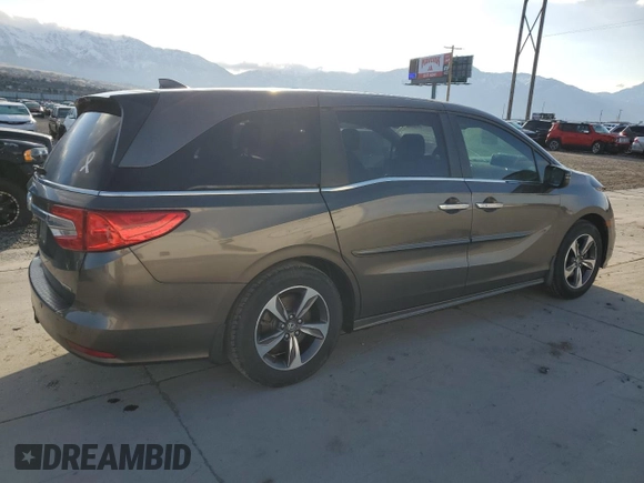 2018 Honda Odyssey Touring с VIN 5FNRL6H8XJB076145, выставлен на аукционе Copart как лот 51870865 с пробегом 96 486 миль миль и Списание • Salvage title. История ставок и продаж доступна на DreamBid. Изображение 3.