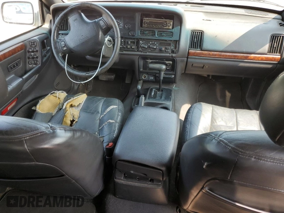 1998 Jeep Grand Cherokee Limited with VIN 1J4GZ78Y5WC324828, listed as a Copart auction lot 58992125 with 225,705 mi miles and Salvage title. Bid and sale history available at DreamBid. Image 8.
