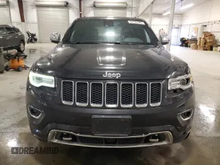 2015 Jeep Grand Cherokee Overland with VIN 1C4RJFCG7FC911899, listed as a Copart auction lot 54123925 with 243,031 mi miles and Salvage Title. Bid and sale history available at carsss.com. Image 5.