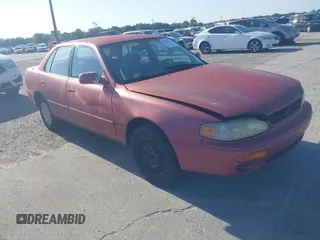 1995 Toyota Camry LE z VIN JT2SK12E6S0318069, wystawiony jako IAAI lot #42003618 z przebiegiem 235 623 mil mil oraz . Historia ofert i sprzedaży dostępna na DreamBid. Obrazek 1.