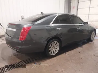 2014 Cadillac CTS Luxury AWD with VIN 1G6AX5S37E0172041, listed as a IAAI auction lot 40343343 with 102,506 mi miles and . Bid and sale history available at DreamBid. Image 4.