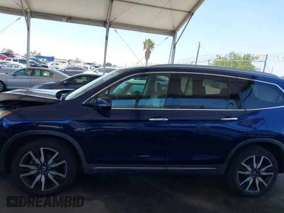 2019 Honda Pilot Touring 8-Passenger z VIN 5FNYF5H97KB013530, wystawiony jako IAAI lot #42403449 z przebiegiem 90 557 mil mil oraz . Historia ofert i sprzedaży dostępna na DreamBid. Obrazek 14.