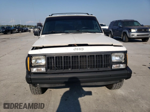 1996 Jeep Cherokee SE with VIN 1J4FT28S3TL197827, listed as a Copart auction lot 75443574 with 116,660 mi miles and Salvage Title. Bid and sale history available at carsss.com. Image 5.