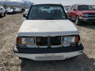 1995 Suzuki Sidekick z VIN JS3TD03V4S4113472, wystawiony jako Copart lot #51279074 z przebiegiem 199 736 mil mil oraz Tytuł czysty. Historia ofert i sprzedaży dostępna na DreamBid. Obrazek 5.