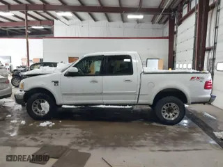 2001 Ford F-150 SuperCrew XLT with VIN 1FTRW08L41KF19093, listed as a IAAI auction lot 41419212 with 157,696 mi miles. Bid and sale history available at carsss.com. Image 14.