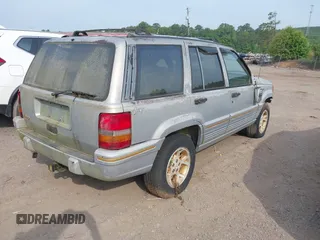 1994 Jeep Grand Cherokee Laredo z VIN 1J4GZ58Y1RC265589, wystawiony jako IAAI lot #42142226 z przebiegiem 138 656 mil mil oraz . Historia ofert i sprzedaży dostępna na DreamBid. Obrazek 4.