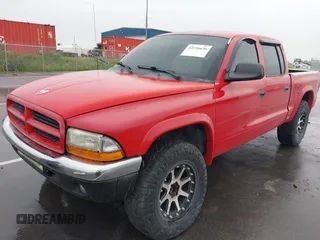 2001 Dodge Dakota Sport z VIN 1B7GG2AN91S110843, wystawiony jako IAAI lot #42316636 z przebiegiem 263 073 mil mil oraz . Historia ofert i sprzedaży dostępna na DreamBid. Obrazek 2.