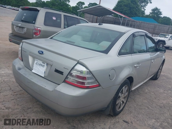 2008 Ford Taurus SEL with VIN 1FAHP24W48G125035, listed as a IAAI auction lot 42149505 with 201,502 mi miles. Bid and sale history available at carsss.com. Image 4.