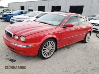 2002 Jaguar X-Type with VIN SAJEA51C52WC51707, listed as a Copart auction lot 84177874 with 98,664 mi miles and Salvage Title. Bid and sale history available at carsss.com. Image 1.