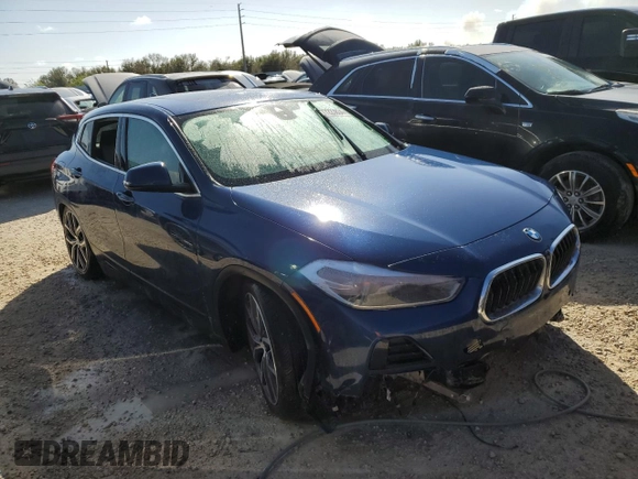 2021 BMW X2 sDrive28i with VIN WBXYH9C02M5S54591, listed as a Copart auction lot 77223834 with 0 mi miles and Salvage Title. Bid and sale history available at carsss.com. Image 4.