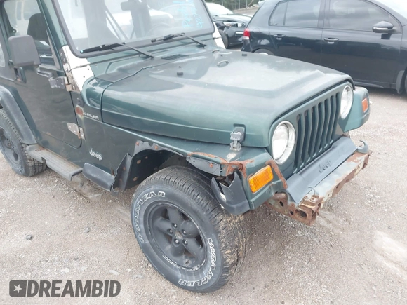 1999 Jeep Wrangler SE z VIN 1J4FY29P7XP479351, wystawiony jako IAAI lot #42797020 z przebiegiem 171 598 mil mil oraz . Historia ofert i sprzedaży dostępna na DreamBid. Obrazek 12.
