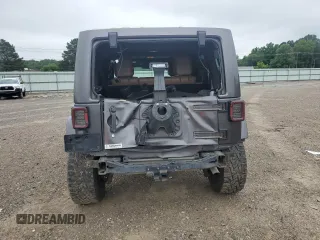 2014 Jeep Wrangler Unlimited Sahara with VIN 1C4HJWEG7EL299548, listed as a Copart auction lot 58522355 with 76,057 mi miles and Clean title. Bid and sale history available at DreamBid. Image 6.