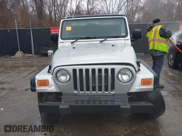 2006 Jeep Wrangler Sport Right Hand Drive with VIN 1J4F449SX6P764491, listed as a IAAI auction lot 41709726 with 290,798 mi miles. Bid and sale history available at carsss.com. Image 12.