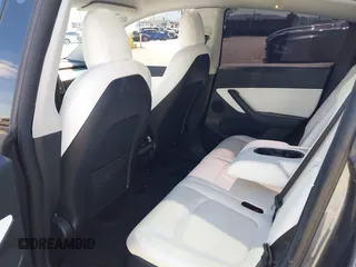 2022 Tesla Model Y Long Range with VIN 7SAYGAEEXNF381389, listed as a IAAI auction lot 41613075 with 52,800 mi miles and . Bid and sale history available at carsss.com. Image 8.