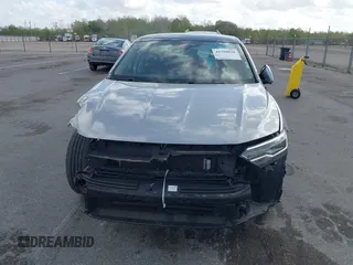 2023 Volkswagen Jetta SE z VIN 3VW7M7BU2PM056005, wystawiony jako IAAI lot #41768826 z przebiegiem 33 838 mil mil oraz . Historia ofert i sprzedaży dostępna na DreamBid. Obrazek 13.