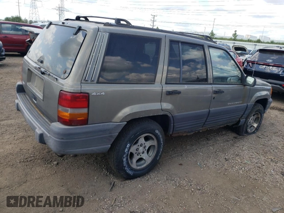1997 Jeep Grand Cherokee Laredo z VIN 1J4GZ58S4VC502596, wystawiony jako Copart lot #88255865 z przebiegiem Nie podano mil oraz Nie do naprawy • Non repairable. Historia ofert i sprzedaży dostępna na DreamBid. Obrazek 3.