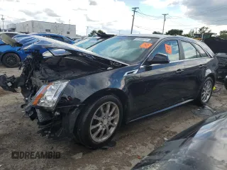 2014 Cadillac CTS with VIN 1G6DH8E3XE0134312, listed as a Copart auction lot 61556874 with 77,194 mi miles and Salvage Title. Bid and sale history available at DreamBid. Image 1.