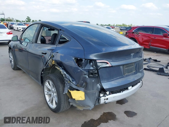 2023 Tesla Model Y Long Range with VIN 7SAYGDEEXPA078629, listed as a IAAI auction lot 42046354 with 27,245 mi miles and . Bid and sale history available at DreamBid. Image 3.