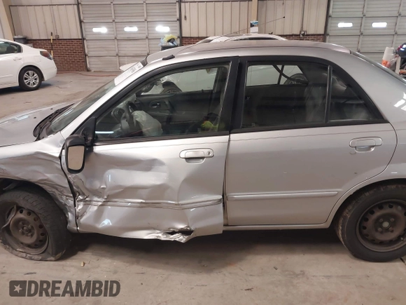 2000 Mazda Protege DX with VIN JM1BJ2226Y0206340, listed as a IAAI auction lot 41645396 with 238,500 mi miles and . Bid and sale history available at DreamBid. Image 14.