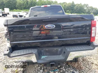 2020 Ford F-250 XL with VIN 1FT8W2BTXLEE30615, listed as a Copart auction lot 60626295 with 142,318 mi miles and Salvage title. Bid and sale history available at DreamBid. Image 6.