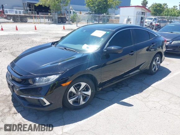 2020 Honda Civic LX with VIN 19XFC2F66LE213975, listed as a IAAI auction lot 42398098 with 69,902 mi miles and . Bid and sale history available at DreamBid. Image 2.