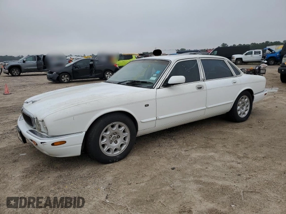 1998 Jaguar XJ with VIN SAJHX1248WC835728, listed as a Copart auction lot 86698244 with 116,768 mi miles and Clean title. Bid and sale history available at DreamBid. Image 1.
