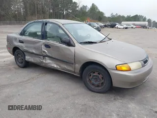 1997 Mazda Protege DX with VIN JM1BC141XV0166395, listed as a IAAI auction lot 41541808 with Not Provided miles and . Bid and sale history available at DreamBid. Image 1.