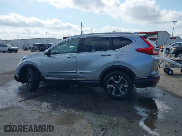 2018 Honda CR-V Touring with VIN 7FARW1H90JE012526, listed as a IAAI auction lot 42055078 with 96,098 mi miles and . Bid and sale history available at DreamBid. Image 14.