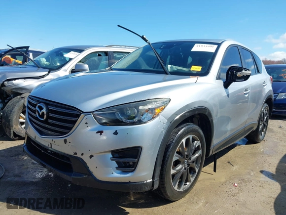 2016 Mazda CX-5 Grand Touring with VIN JM3KE4DY9G0795360, listed as a IAAI auction lot 41933991 with 176,373 mi miles. Bid and sale history available at carsss.com. Image 17.
