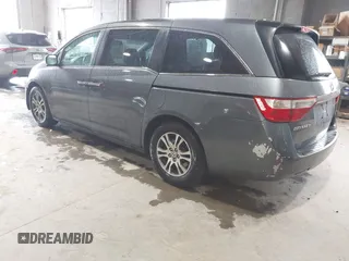 2012 Honda Odyssey EX-L with VIN 5FNRL5H63CB137198, listed as a IAAI auction lot 42706690 with 305,753 mi miles and . Bid and sale history available at DreamBid. Image 3.