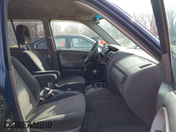 2004 Chevrolet Tracker ZR2 z VIN 2CNBJ734746917149, wystawiony jako IAAI lot #41649562 z przebiegiem 216 092 mil mil oraz . Historia ofert i sprzedaży dostępna na DreamBid. Obrazek 5.
