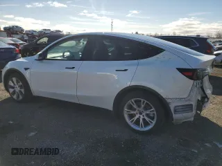 2023 Tesla Model Y Long Range z VIN 7SAYGAEE2PF758235, wystawiony jako Copart lot #49059895 z przebiegiem 57 615 mil mil oraz Czysty tytuł • Clean title. Historia ofert i sprzedaży dostępna na DreamBid. Obrazek 2.