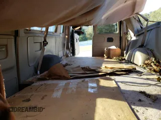1999 Ford Econoline Passenger XL with VIN 1FBSS31L0XHB12679, listed as a Copart auction lot 74257504 with 136,821 mi miles and Salvage Title. Bid and sale history available at DreamBid. Image 10.