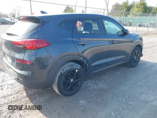 2019 Hyundai Tucson SE with VIN KM8J23A4XKU932814, listed as a IAAI auction lot 40968319 with 107,365 mi miles. Bid and sale history available at carsss.com. Image 4.