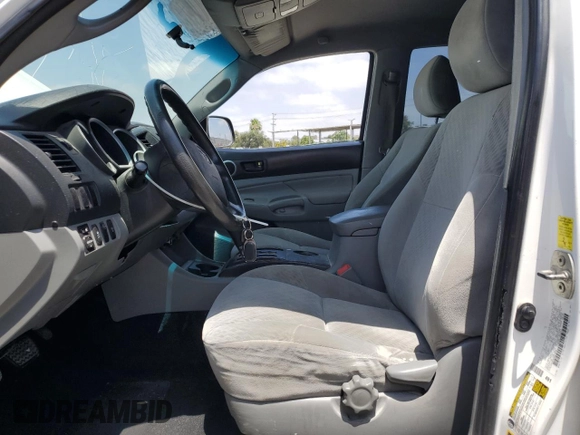 2010 Toyota Tacoma with VIN 3TMLU4EN6AM041048, listed as a Copart auction lot 61290985 with 199,384 mi miles and Salvage title. Bid and sale history available at DreamBid. Image 7.