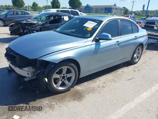 2014 BMW 3 Series 320i xDrive with VIN WBA3C3C59EF986353, listed as a IAAI auction lot 42383107 with 142,836 mi miles and . Bid and sale history available at DreamBid. Image 2.