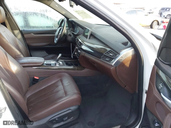 2018 BMW X5 xDrive40e iPerformance with VIN 5UXKT0C58J0V99415, listed as a IAAI auction lot 41391474 with 124,671 mi miles. Bid and sale history available at carsss.com. Image 5.